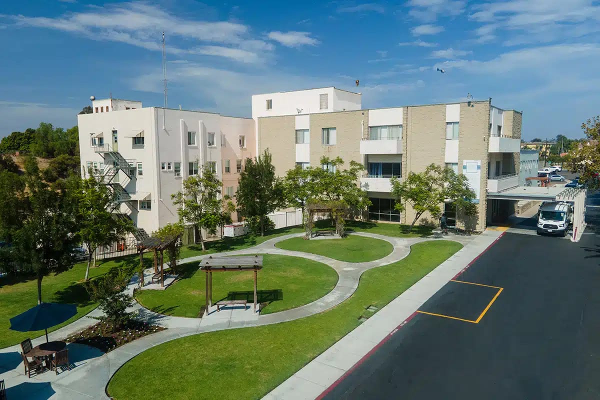 Aerial view of the facility with gardens and walking paths