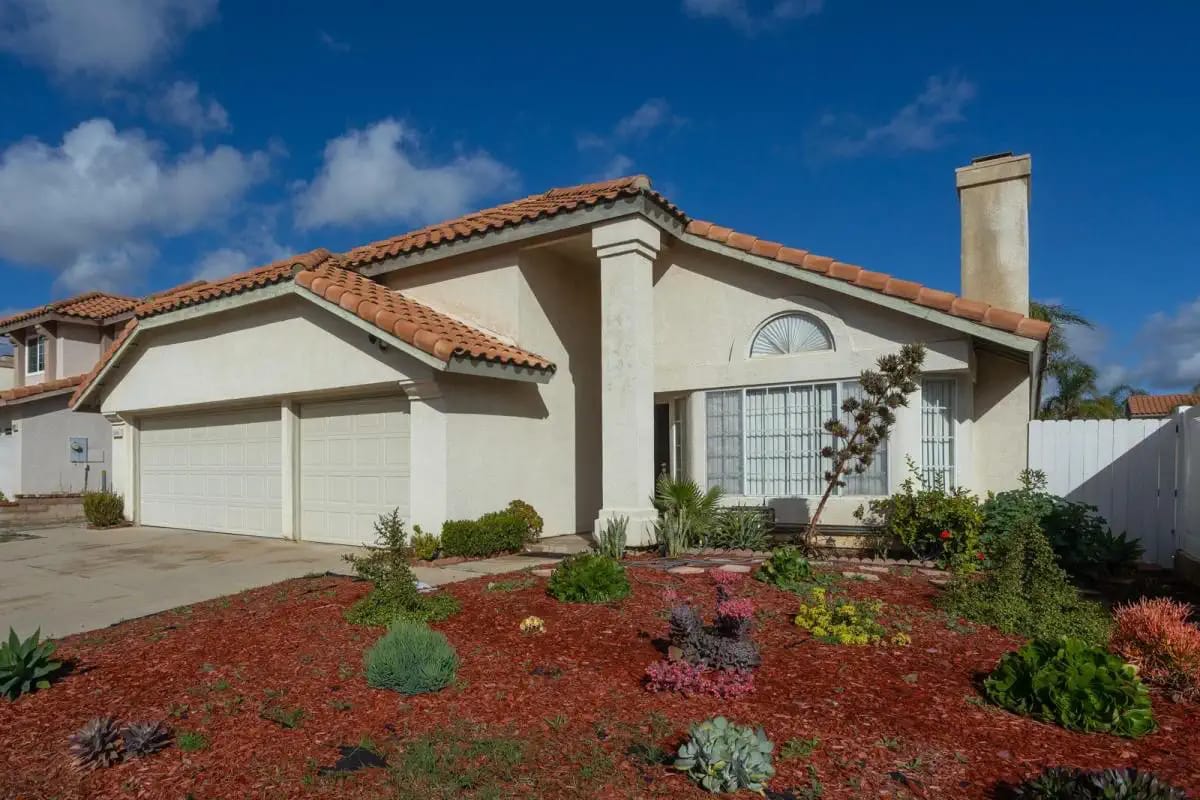 Exterior view of a residential building with landscaping