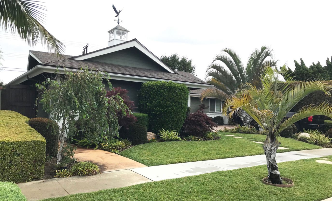 Exterior view of a senior living facility with landscaping