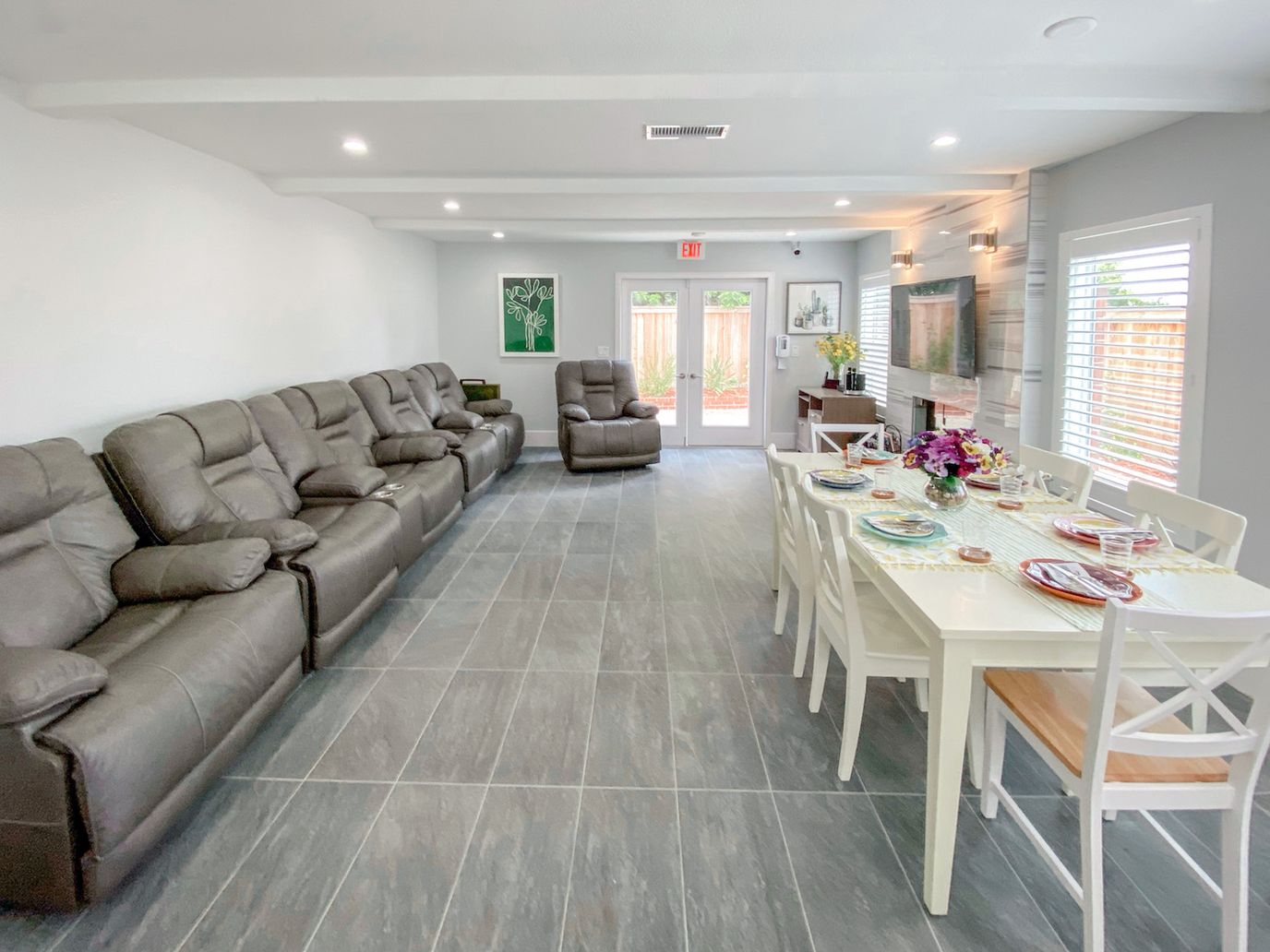 Bright common area with seating and dining table