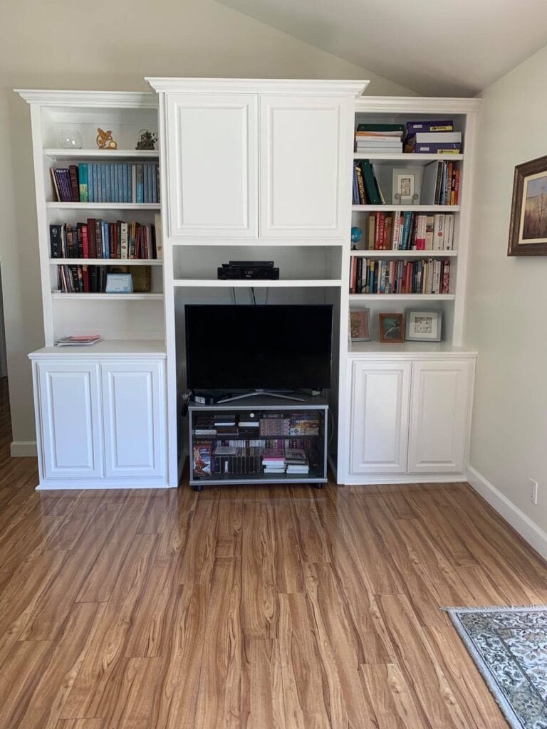 Interior view of a living space with shelves and TV