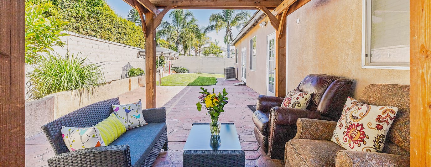 Cozy outdoor seating area with plants