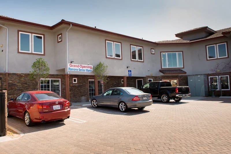 Exterior view of Ramona Senior Manor with parking