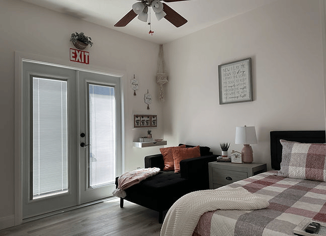 Cozy private resident room with a bed and seating area
