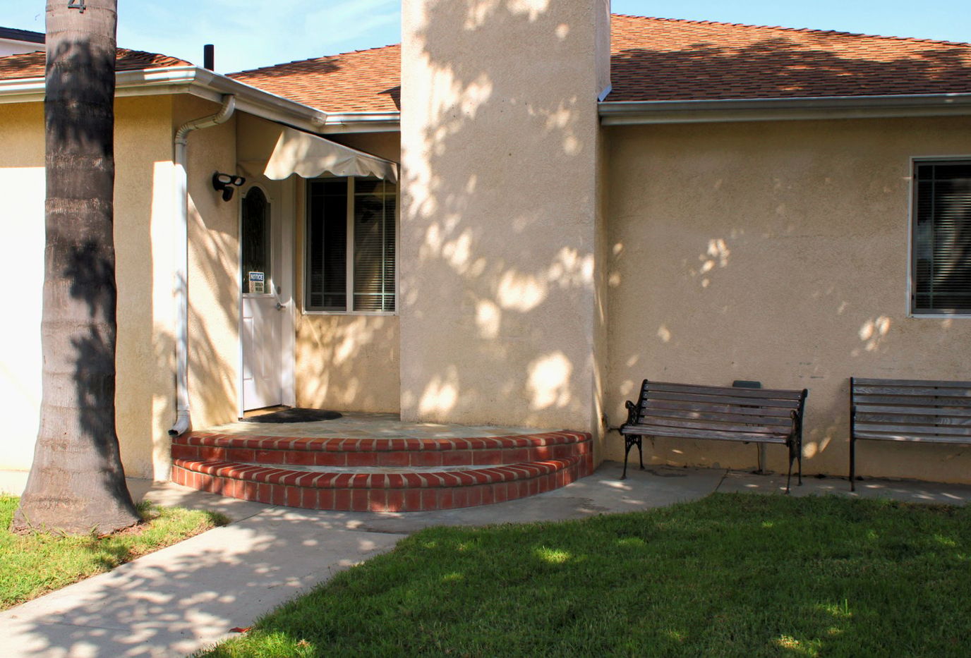 Entrance with seating and garden area