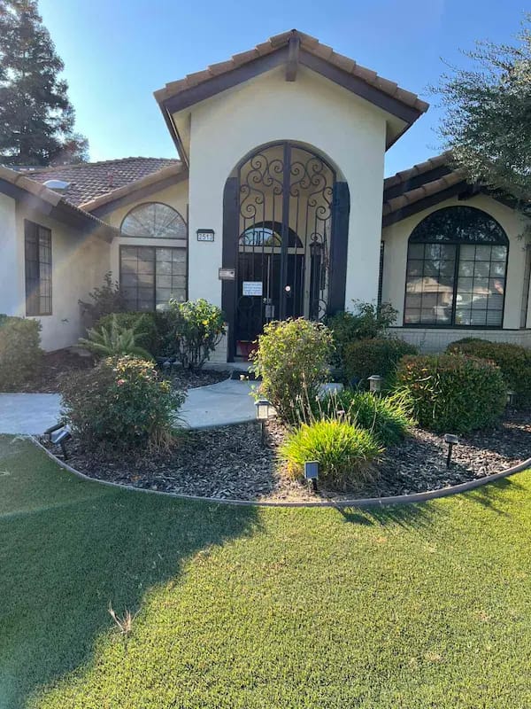 Exterior view of the facility entrance and garden