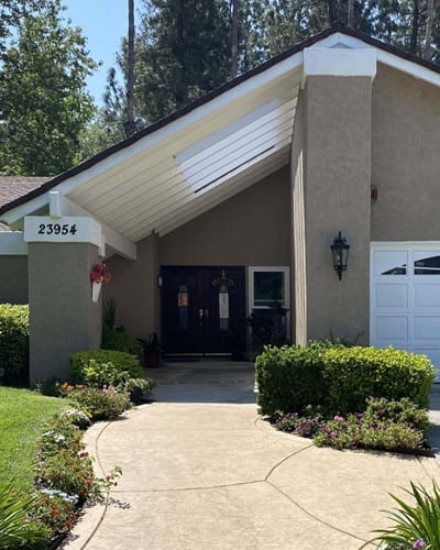 Main entrance of Valencia Hills Home with landscaping