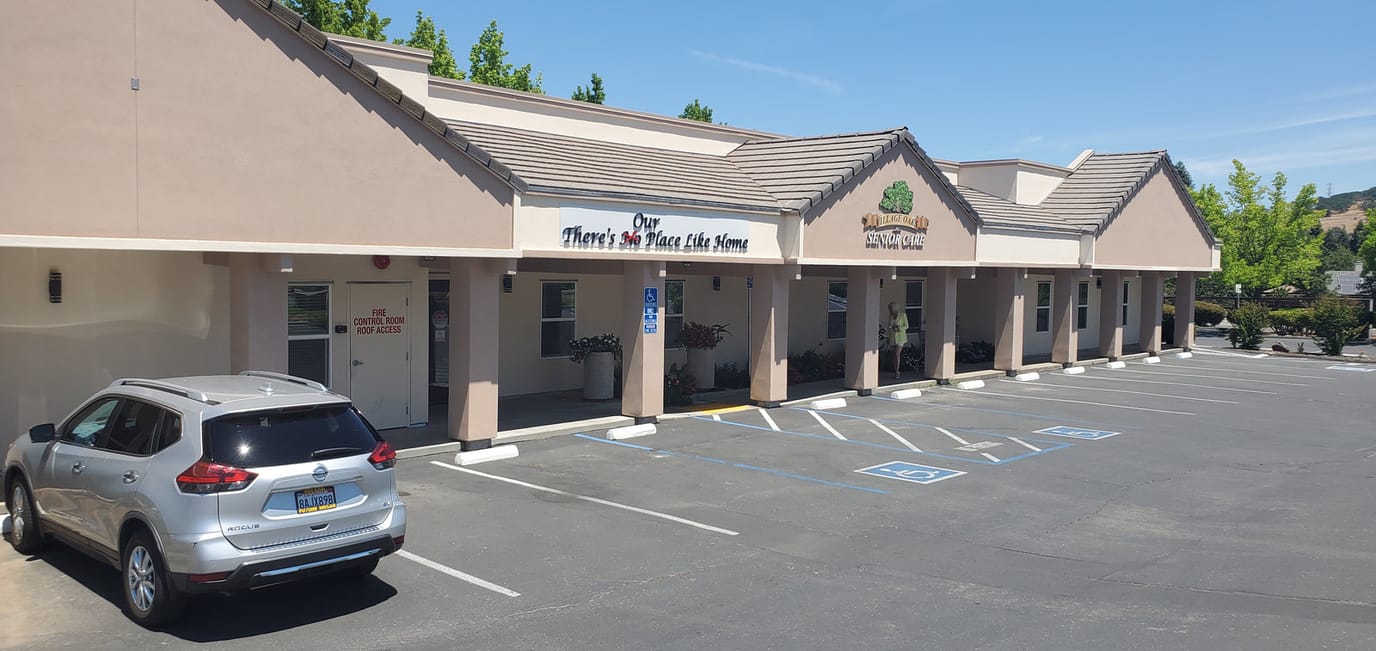 Exterior view of Village Oaks Senior Care facility