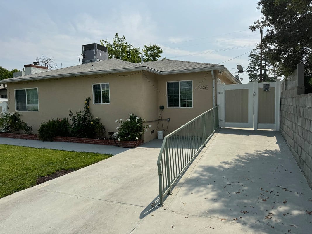 Exterior view of a residential facility with garden area
