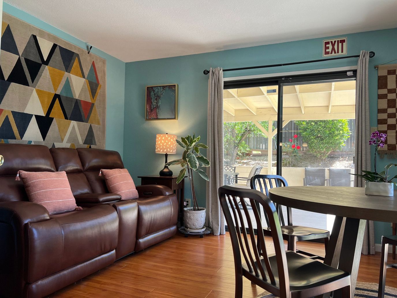 Interior lounge area with seating and access to outdoor space