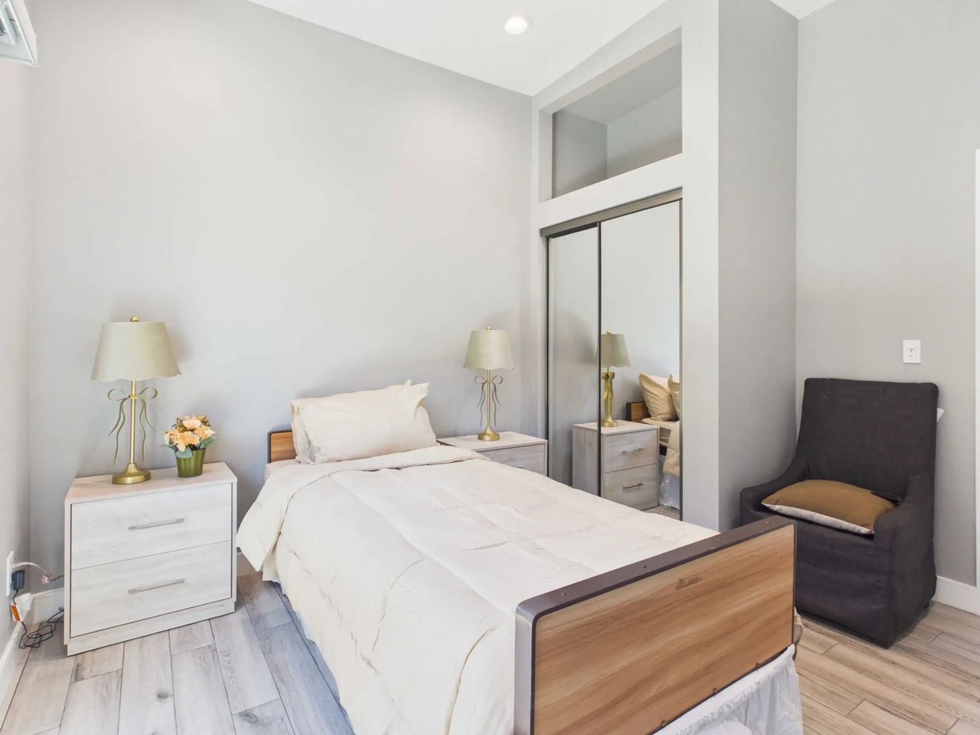Bright private room with bed and furnishings