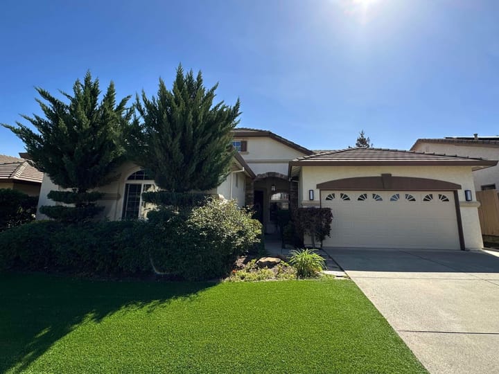 Exterior view of a house with green lawn