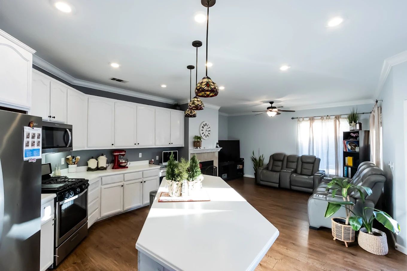 Bright and spacious common area with kitchen and seating