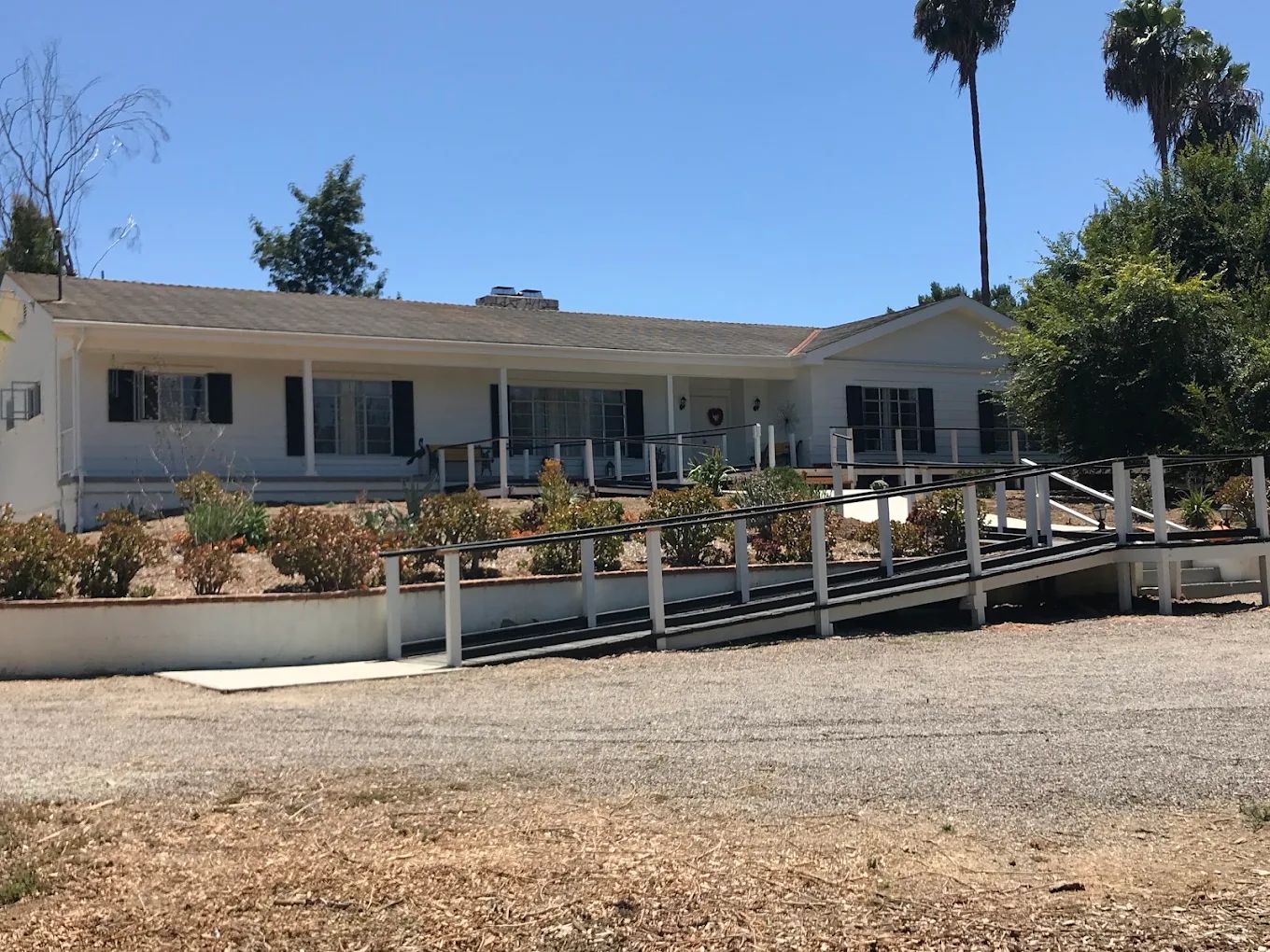 Exterior view of Caring Hearts Cottage with accessible ramp