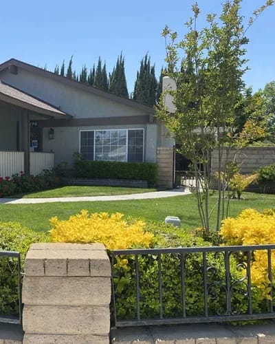 Exterior view of Cypress Residence II with landscaped garden