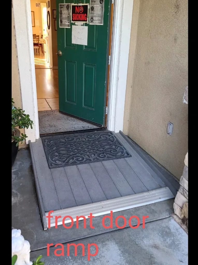 Entrance with a wheelchair ramp and door