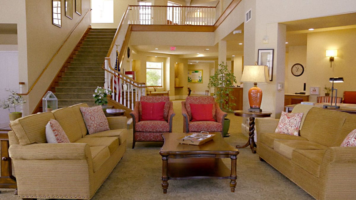 Cozy common area with seating and a staircase