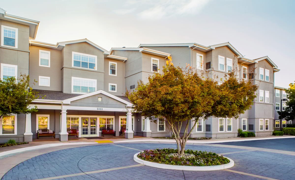 Building exterior with landscaped entrance