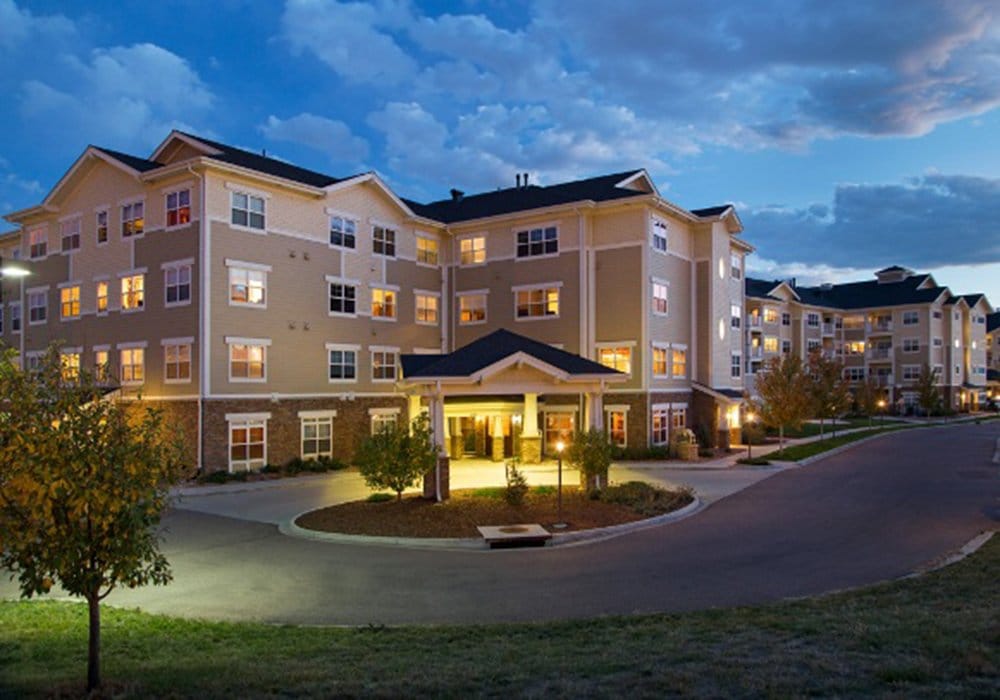 Exterior view of the assisted living facility at dusk