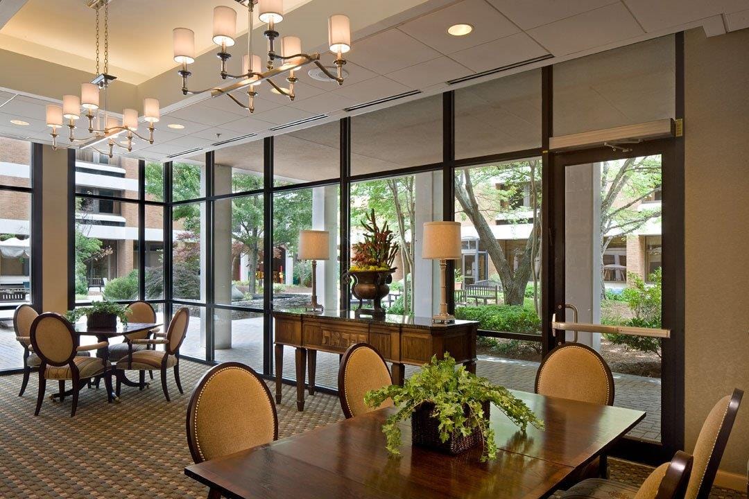 Bright common area with large windows and outdoor views