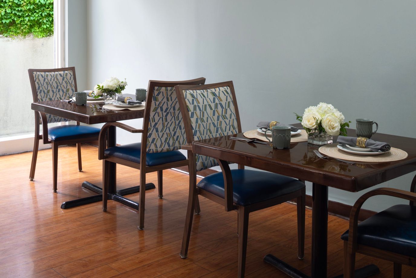 Dining area with tables set for a meal