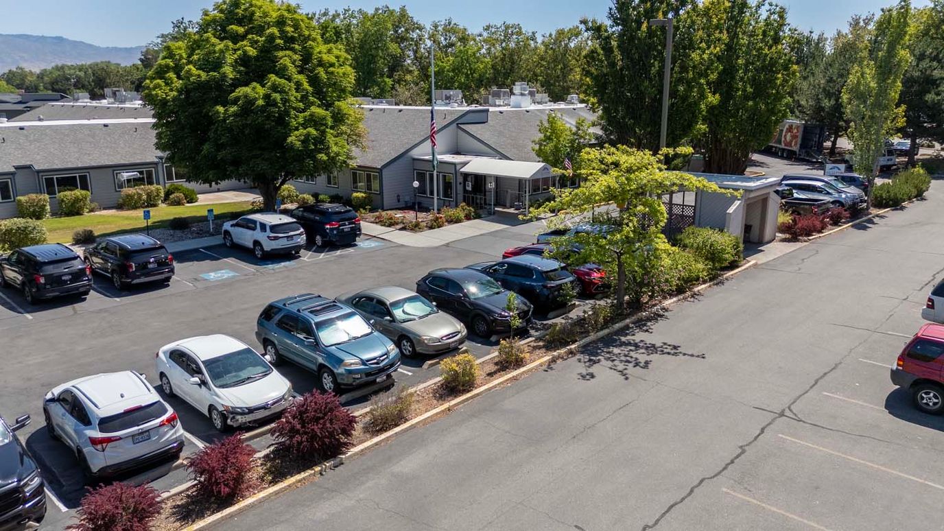 Exterior view of Skyline Transitional Care Center with parking lot