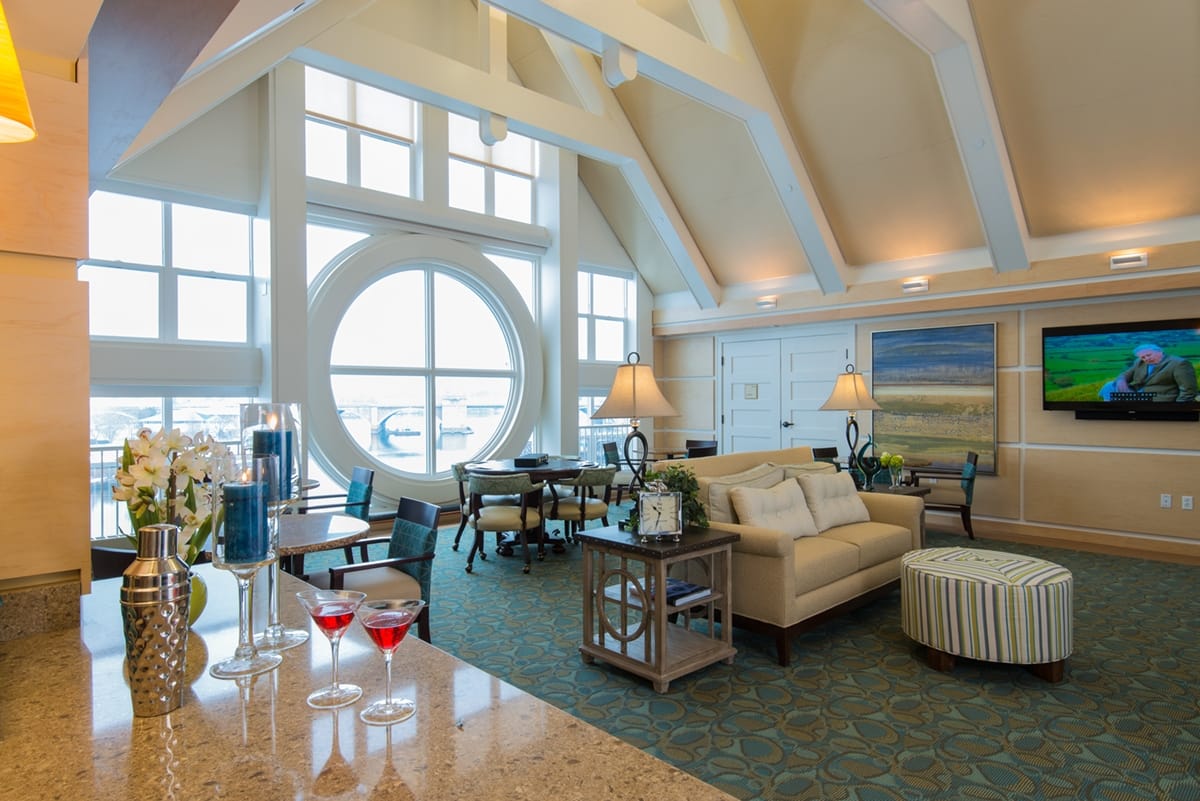 Bright common area with seating and large windows