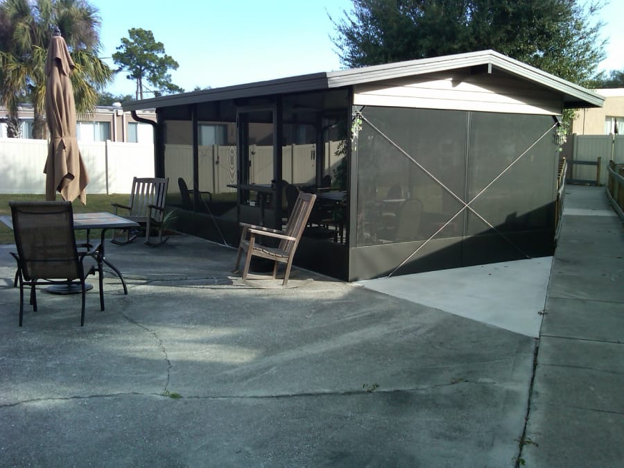 Outdoor seating area with tables and chairs
