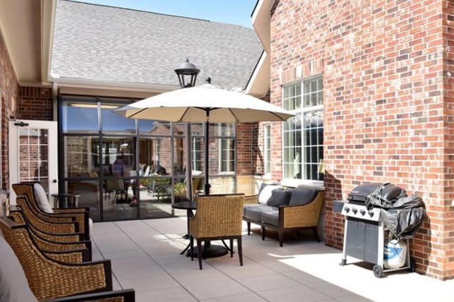 Outdoor patio area with seating and umbrella