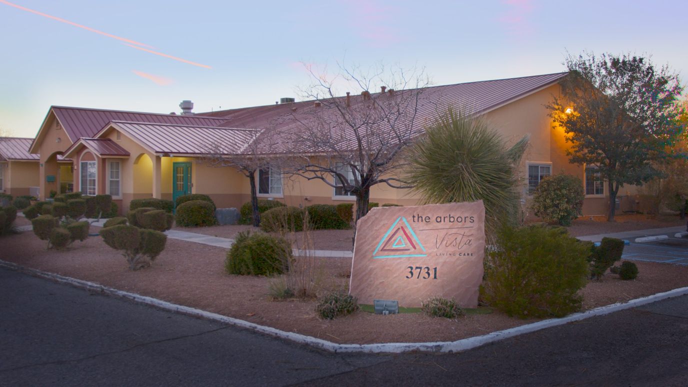 Exterior view of assisted living facility with landscaping