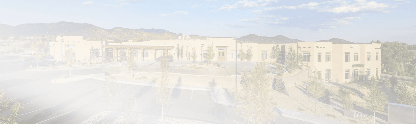 Exterior view of the assisted living facility with surrounding landscape