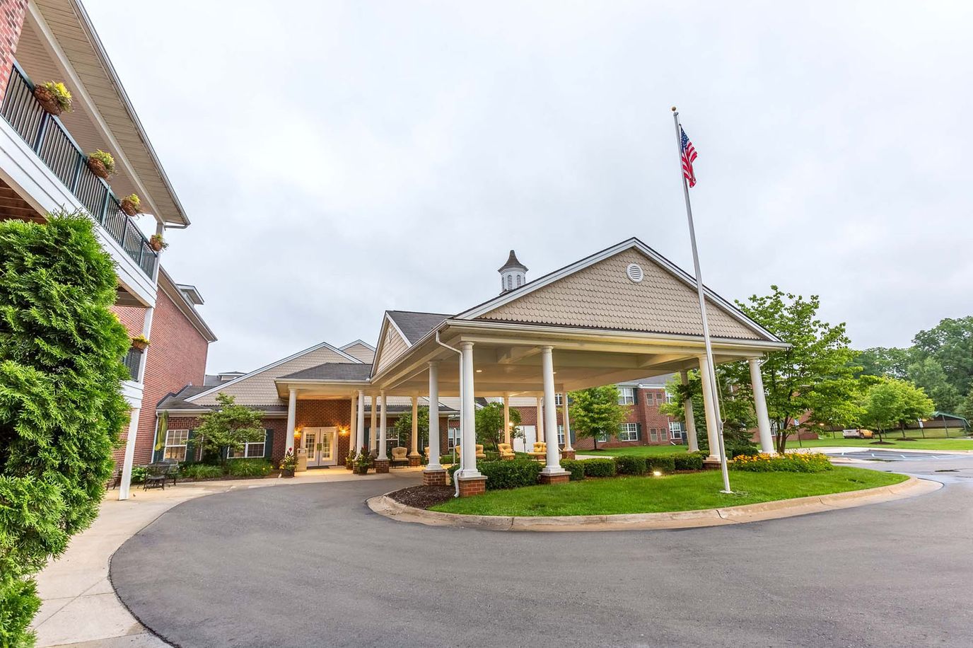 Entrance of Independence Village of Brighton Valley with outdoor landscaping
