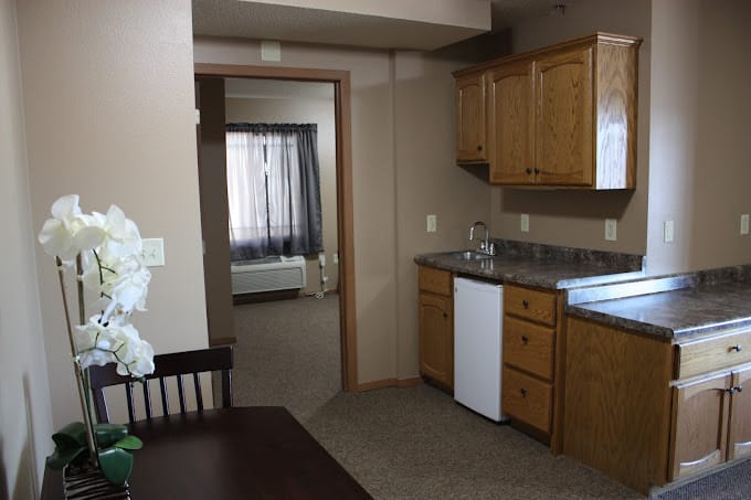 Interior view of a resident unit's kitchenette and living area