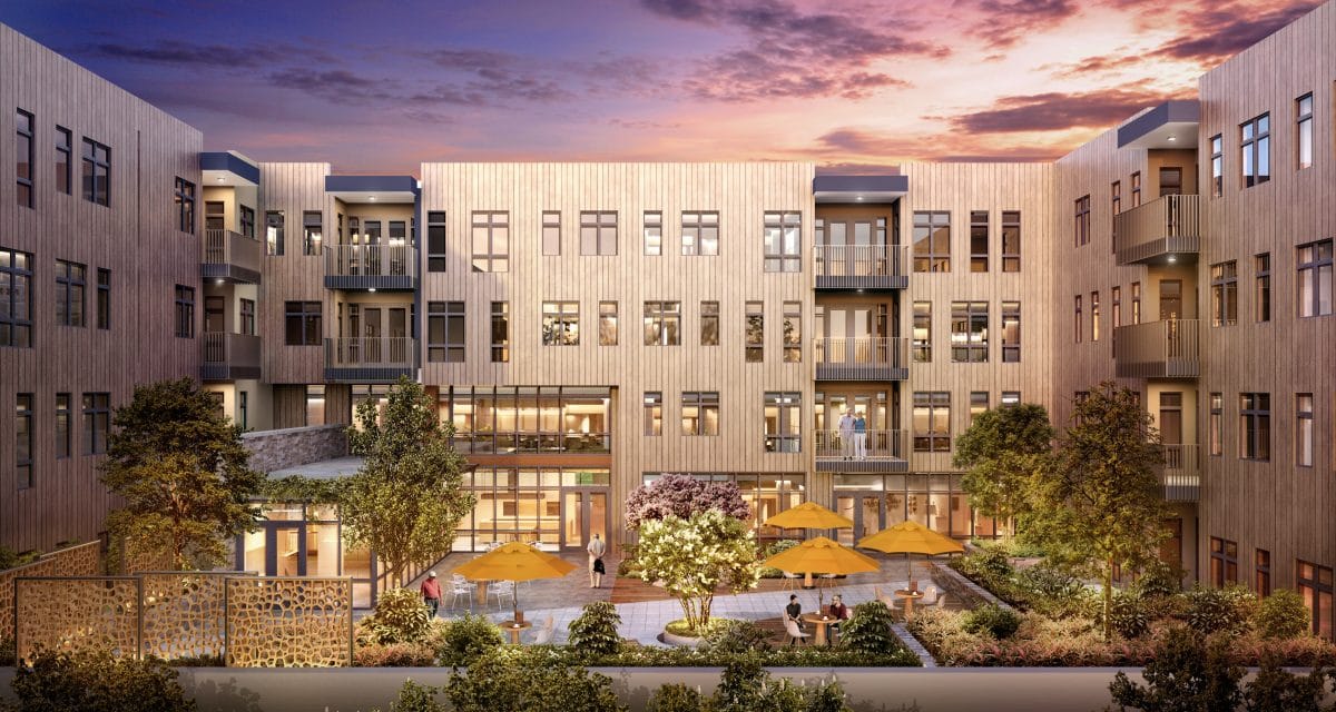 Outdoor area of the facility with residents and seating