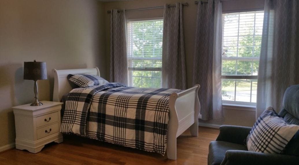 Cozy interior of a private resident room with a bed