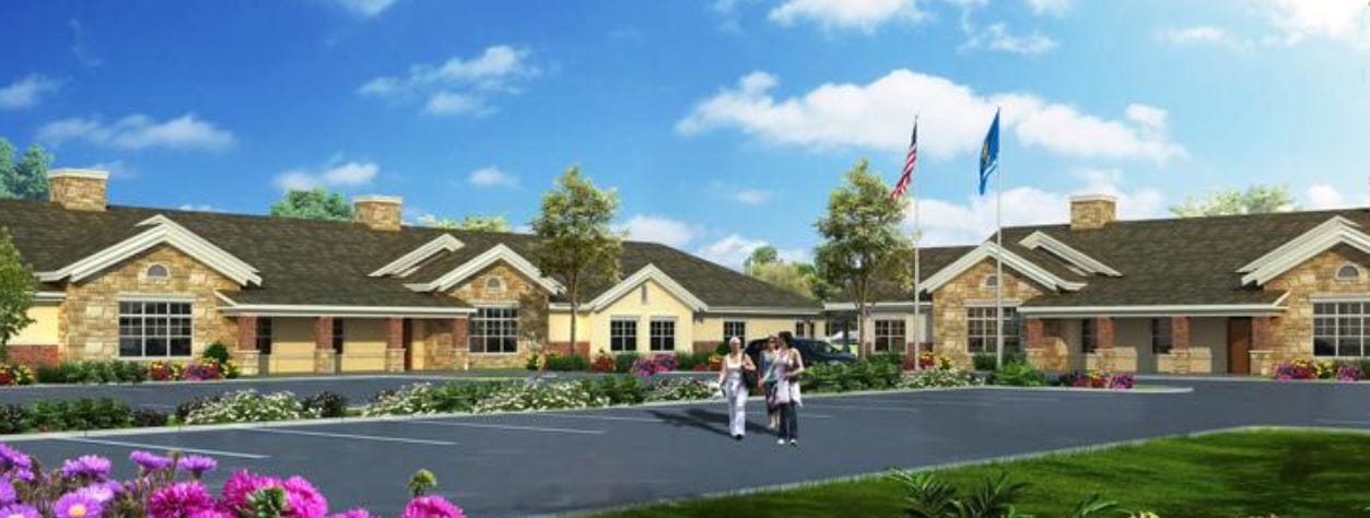 Exterior view of the facility with residents walking
