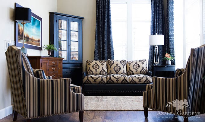 A stylish living room featuring a sofa and two armchairs