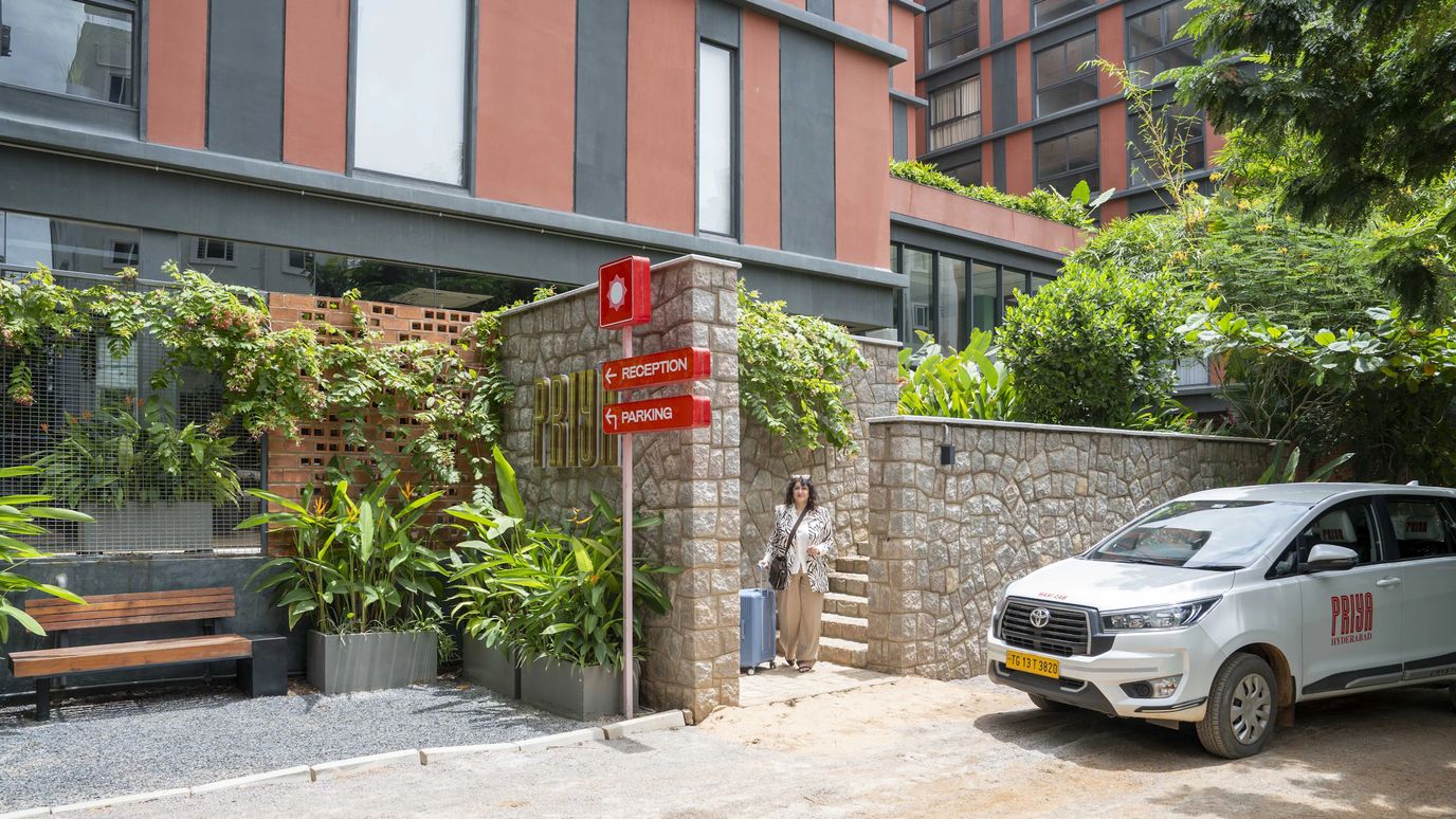 Exterior view of a senior living facility with signage