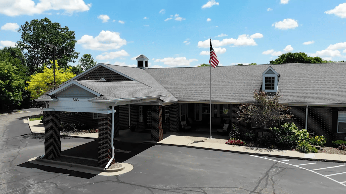 Aerial view of the facility entrance with flag