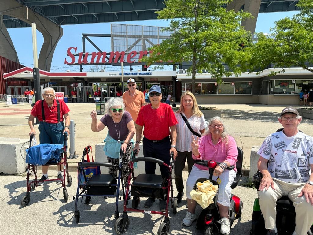 Residents enjoying an outing in front of a building
