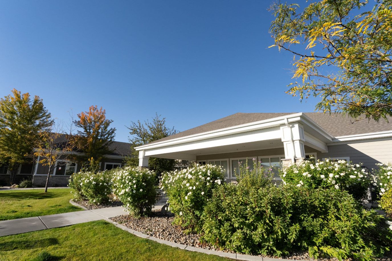 Exterior view of the facility surrounded by greenery.