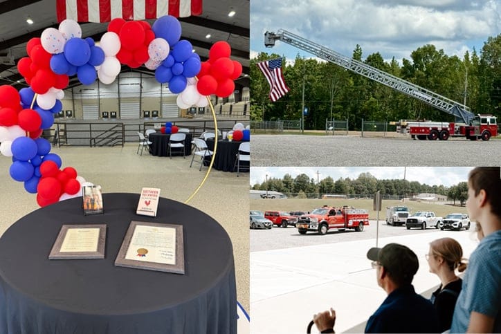 People observing a fire truck at a community event
