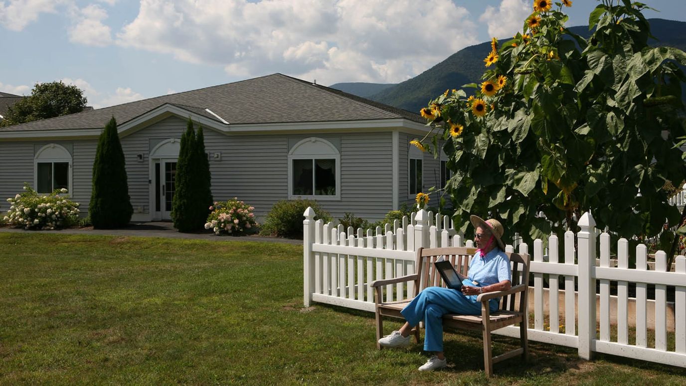 Resident enjoying the outdoors near the facility