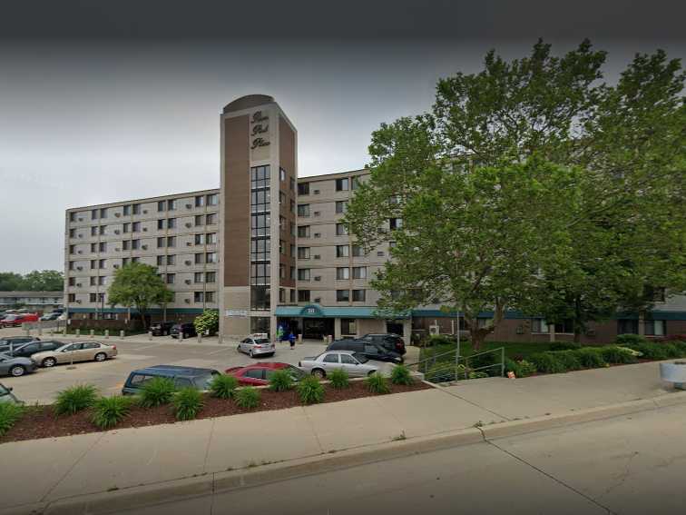 Exterior view of the facility building with parking lot