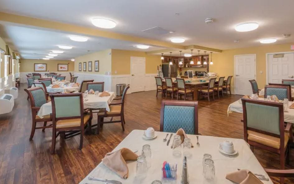 Dining area with tables set for residents