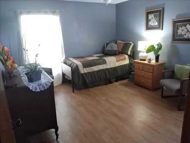 A private resident room with a bed and furniture