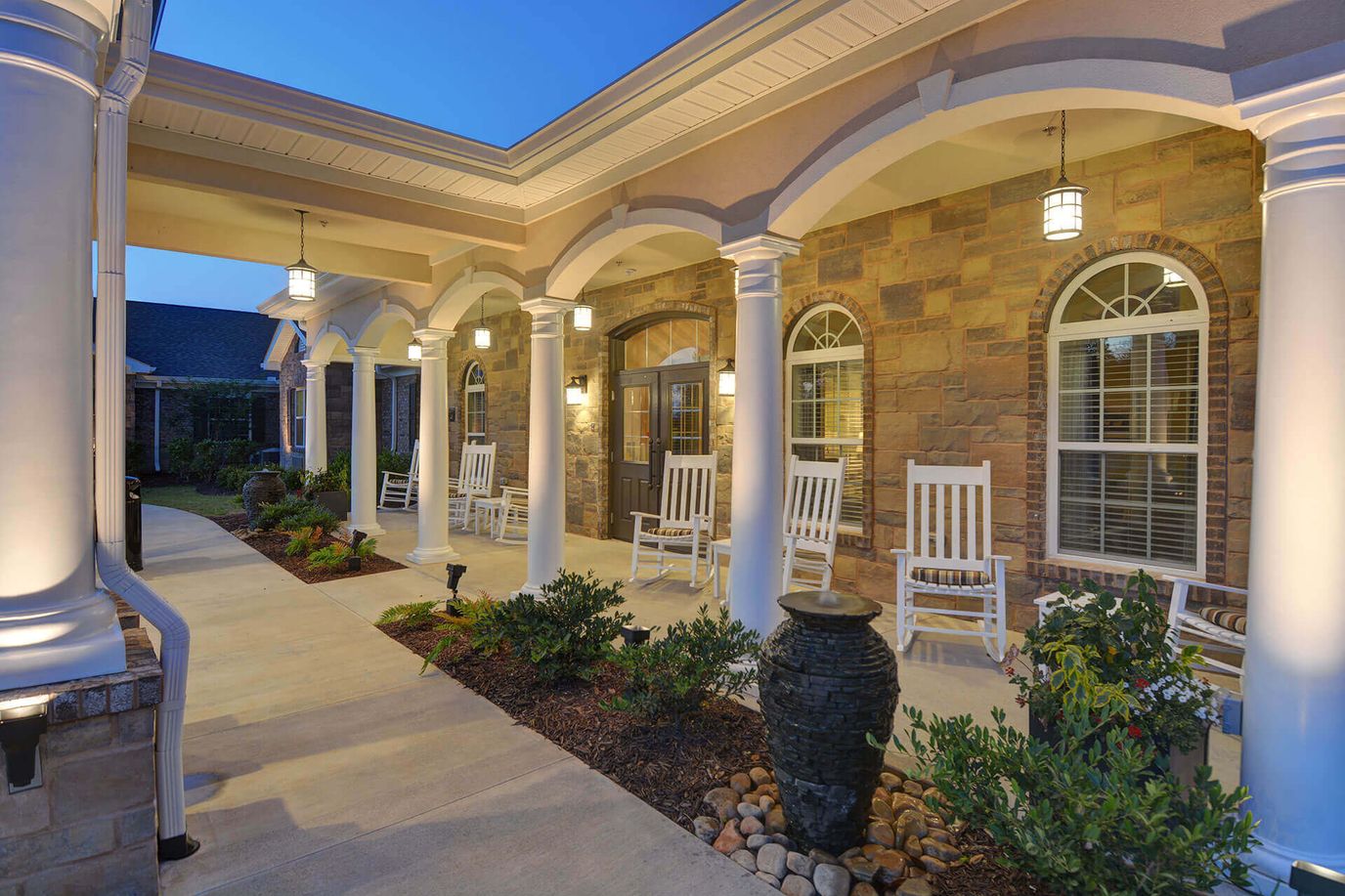 Outside view of the facility entrance with rocking chairs
