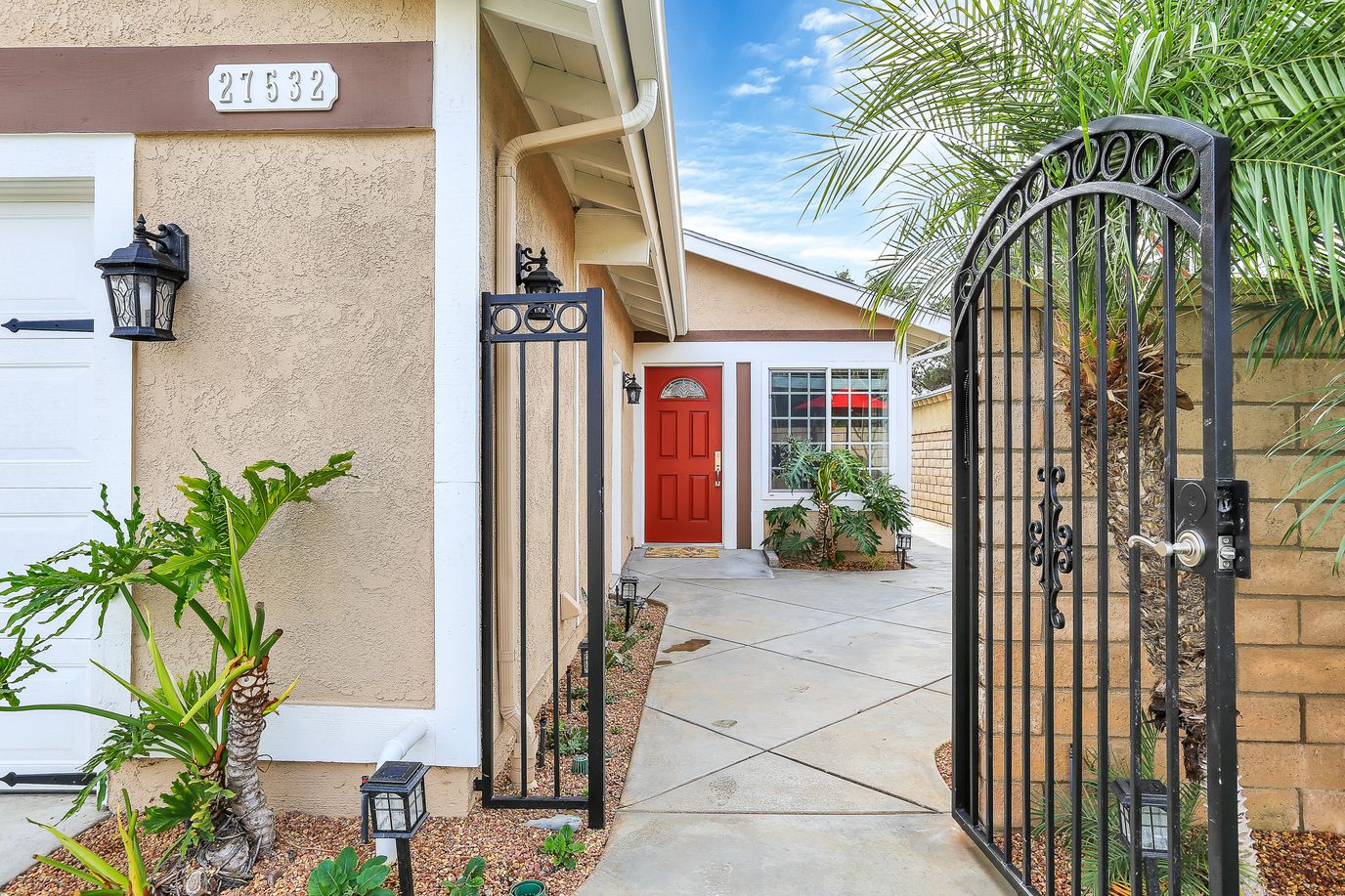 Welcoming entrance to a senior living facility with a red door