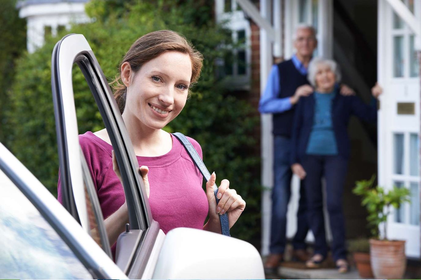Staff member assisting residents at the front door