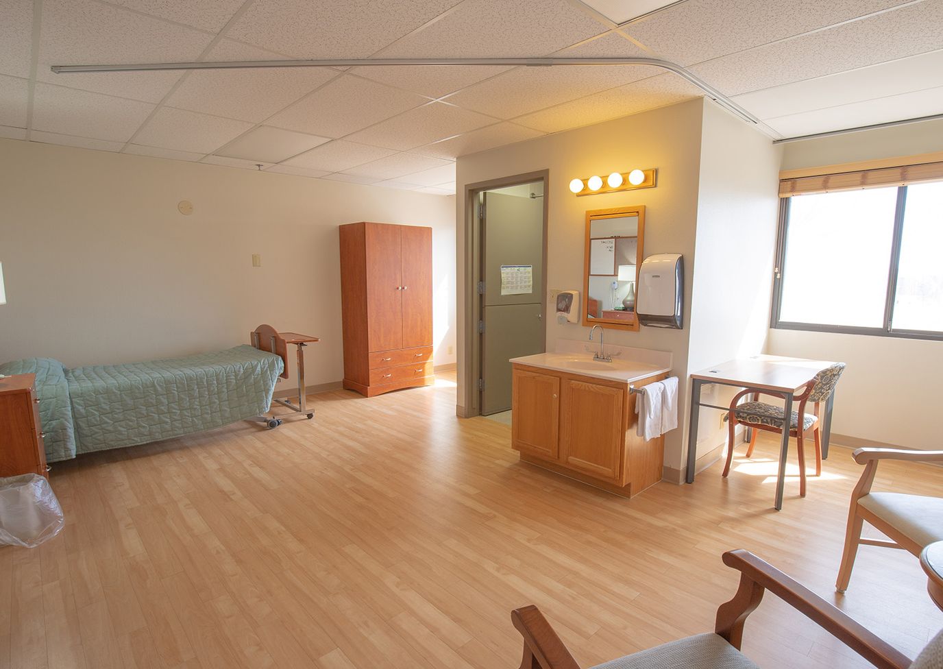 Private resident room with bed and seating area